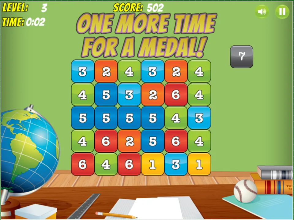 Screenshot of a puzzle game with a grid of numbered blocks and the message "One More Time for a Medal!" shown at the top. The game is at Level 3 with a score of 502 and a timer showing 0:02. A globe, ruler, and baseball are on a desk below the grid.